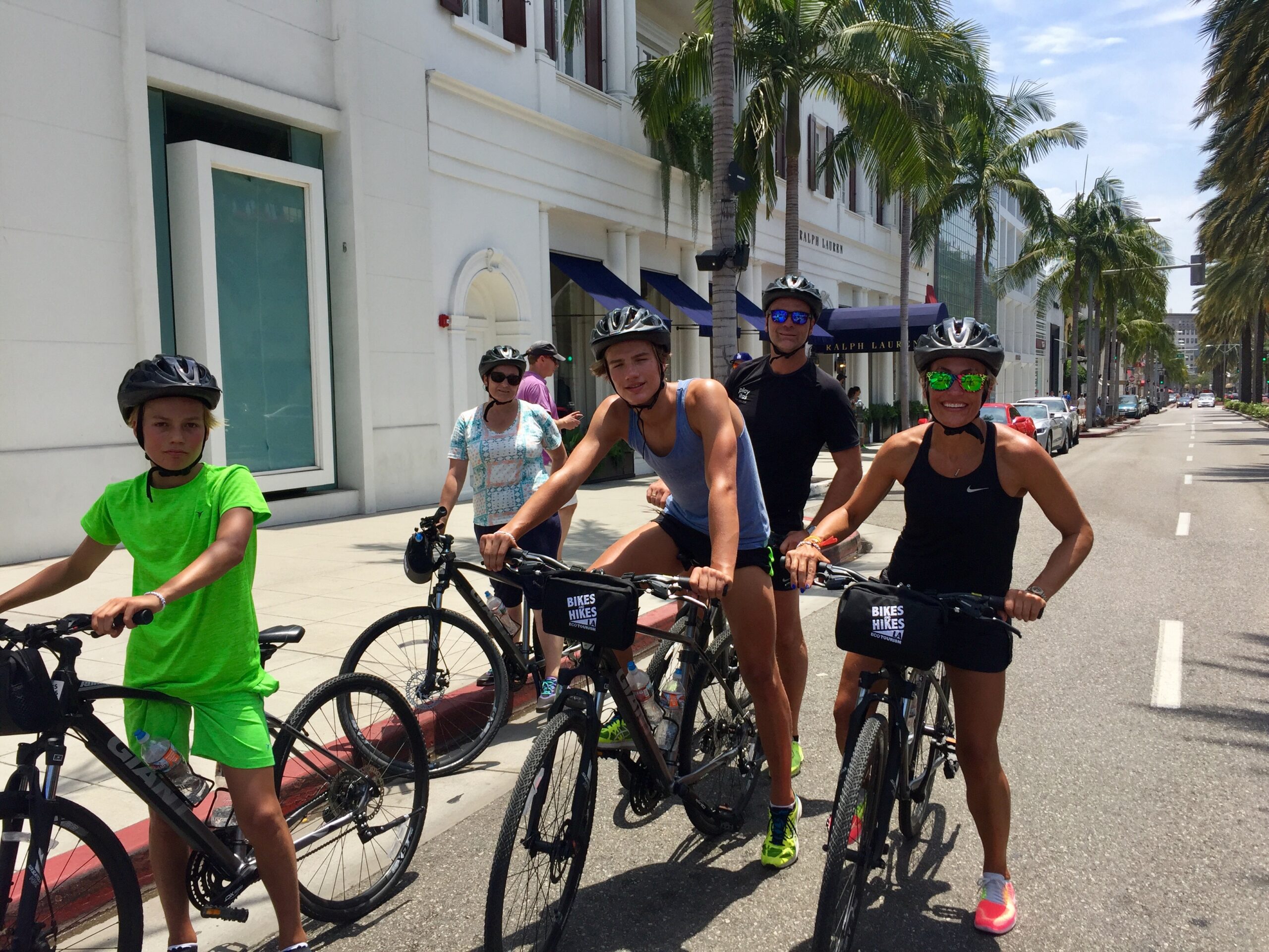 Guests on the Beverly Hills Tour riding down Rodeo drive
