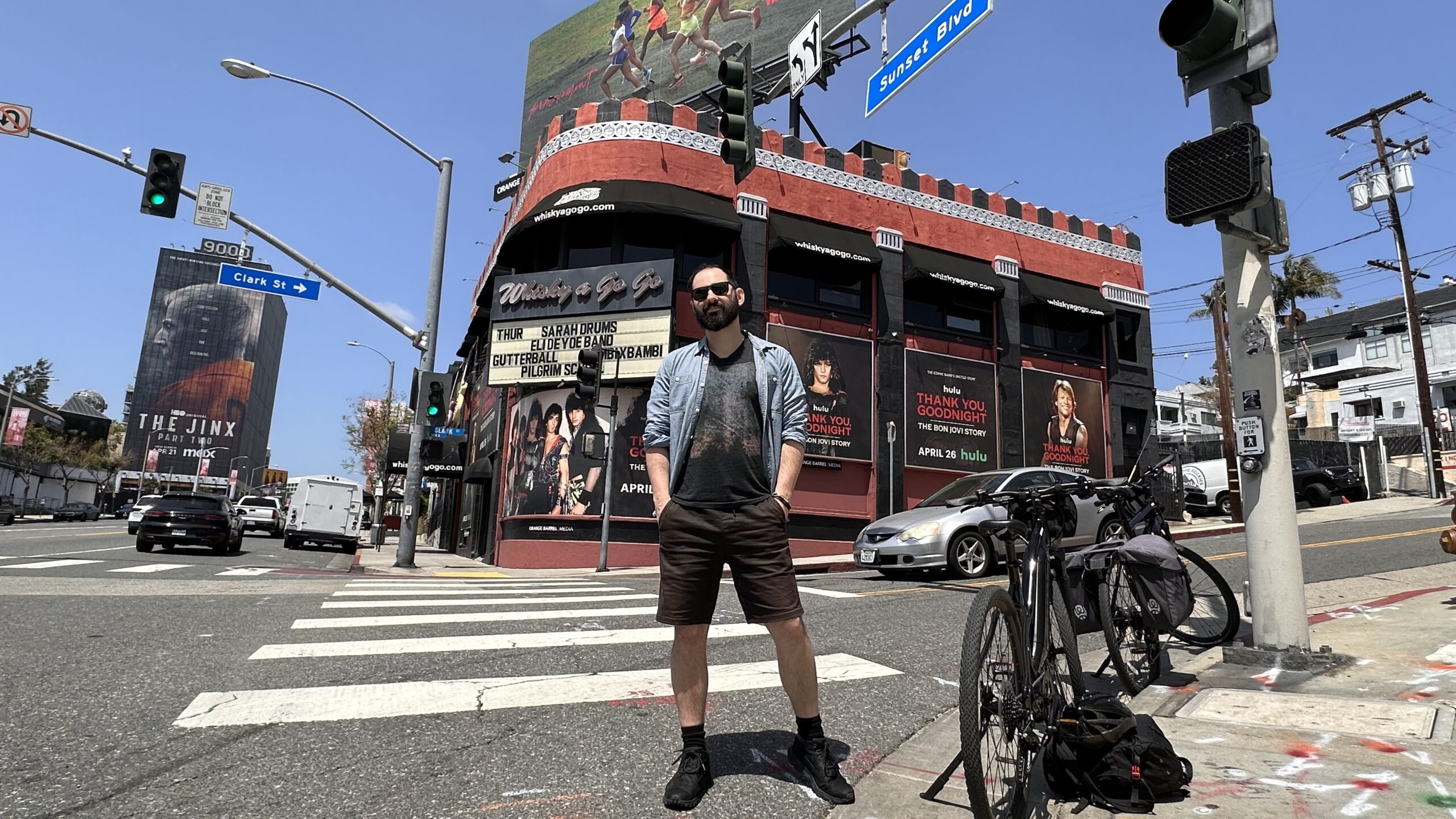 Man standing on sunset boulevard in front of concert venue