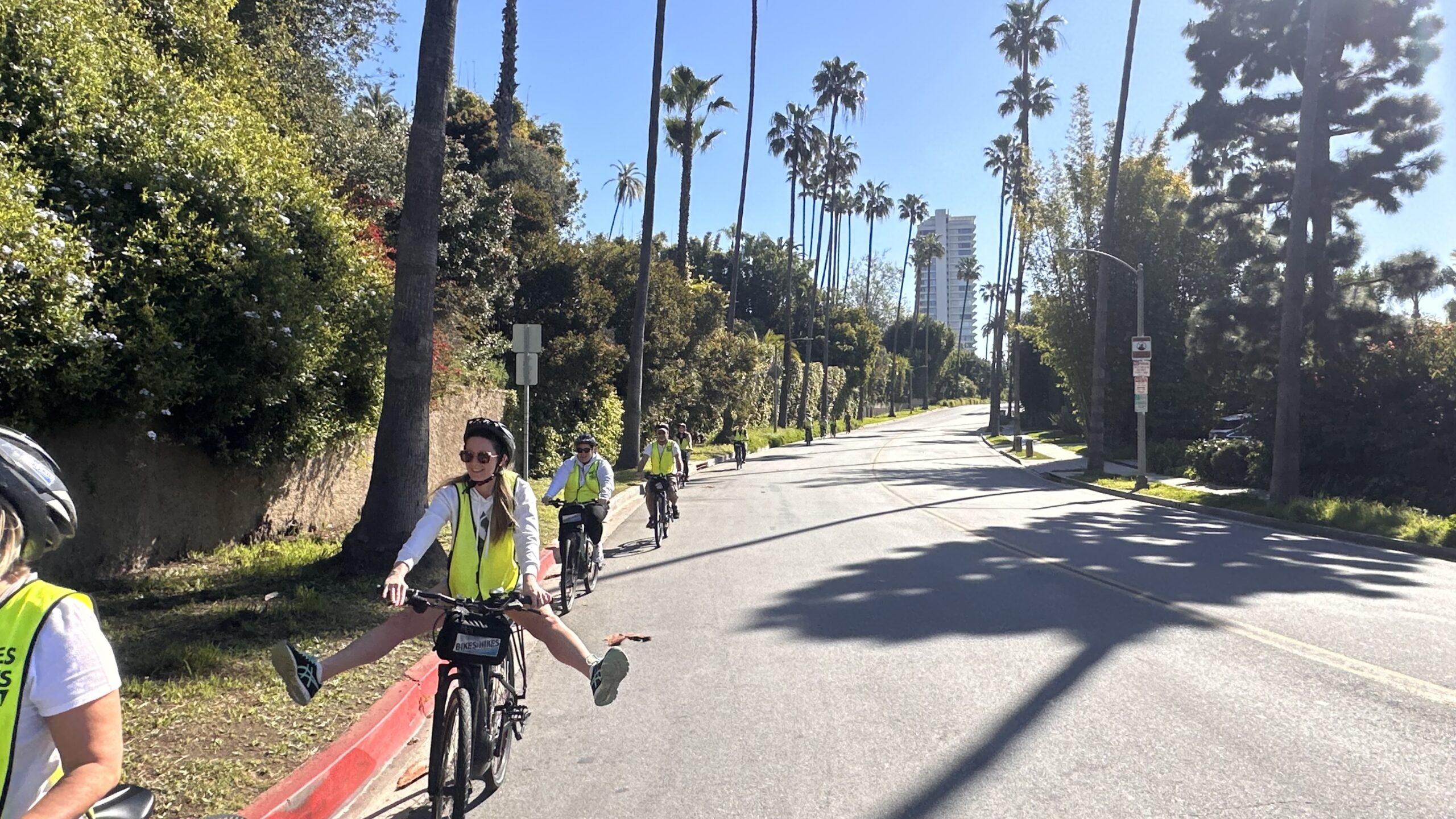 A guest throws her feet up to be funny on the beverly hills tour